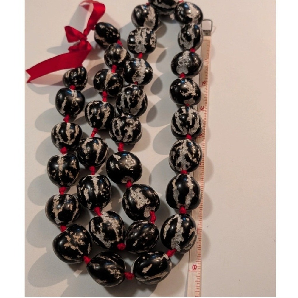 Hawaiian Kukui Nut Lei Necklace Polished Black White Mottled Red Ribbon 36 Inch